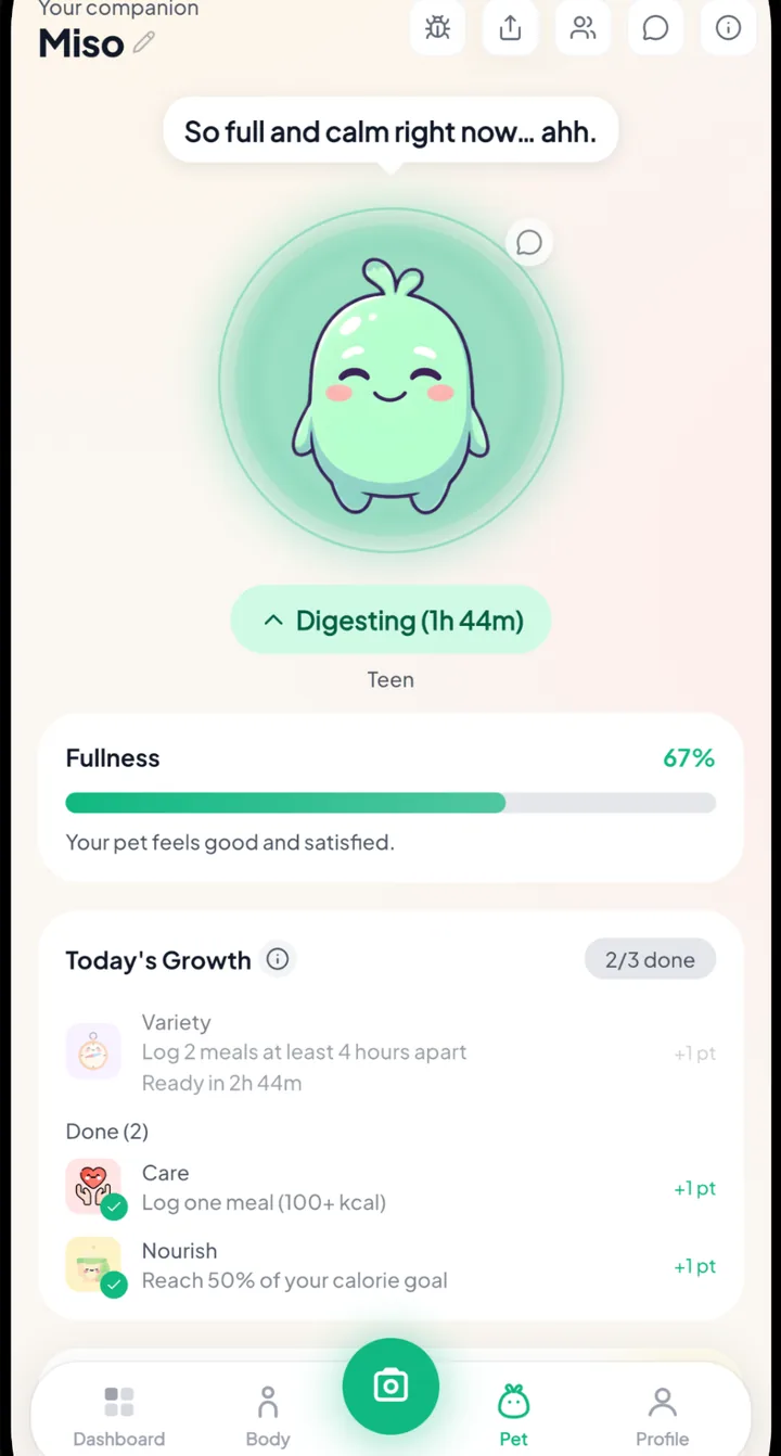 Foodly virtual pet Miso shown happy and digesting after a logged meal